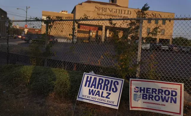 A campaign sign for Vice President Kamala Harris and Gov. Tim Walz is seen in Downtown Springfield, Ohio, near the Springfield News Sun building, Monday, Sept. 16, 2024. (AP Photo/Jessie Wardarski)