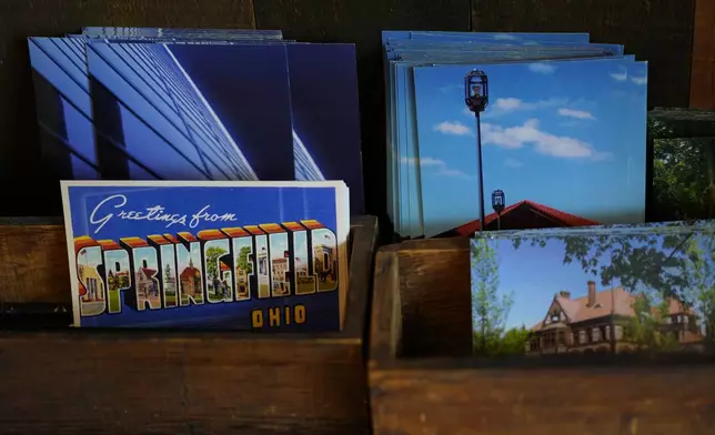 Postcards of Springfield, Ohio, are displayed in the Champion City Guide &amp; Supply, Tuesday, Sept. 17, 2024, in Springfield, Ohio. (AP Photo/Carolyn Kaster)