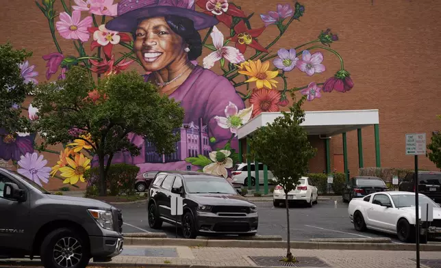 A mural depicting Hattie Moseley, a Springfield Civil Rights activist who was instrumental in battling the segregation of Fulton Elementary School, is painted on the WesBanco building on East Main Street in Springfield, Ohio, Tuesday, Sept. 17, 2024, in Springfield, Ohio. (AP Photo/Carolyn Kaster)