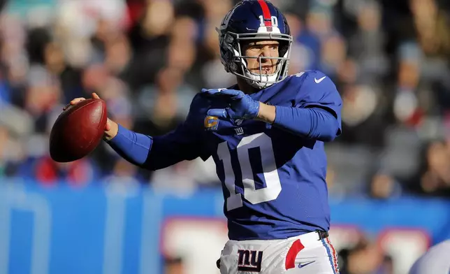 FILE - In this Dec. 15, 2019, file photo, New York Giants quarterback Eli Manning looks to pass in the first half of an NFL football game against the Miami Dolphins in East Rutherford, N.J. (AP Photo/Adam Hunger, File)