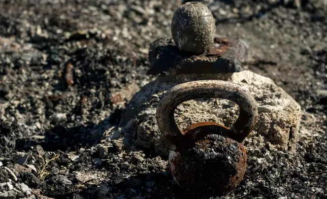 FILE - A burnt kettlebell sits in the debris of a home, Dec. 8, 2023, in Lahaina, Hawaii. (AP Photo/Lindsey Wasson, File)