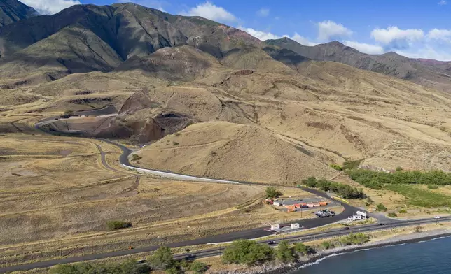 Olowalu temporary landfill site for the debris from the Lahaina fire is seen on Sunday, July 7, 2024, in Lahaina, Hawaii. (AP Photo/Mengshin Lin)