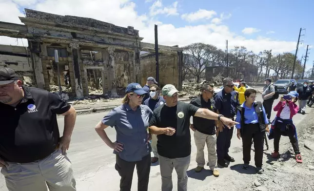 FILE - Hawaii Gov. Josh Green, center, points to damage as he speaks with Federal Emergency Management Agency Administrator Deanne Criswell during a tour of wildfire damage, Saturday, Aug. 12, 2023, in Lahaina, Hawaii. (AP Photo/Rick Bowmer, File)