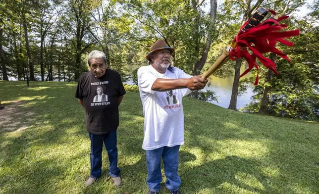 Robyn Soweka Sr., of Hickory Ground Tribal Town, right, describes a tribal challenge issued to the Poarch Band, Tuesday, Sept. 24, 2024, in Wetumoka, Ala. At left is George Thompson, who is the Mekko, a ceremonial leader, of Hickory Ground in the Muscogee Nation. (AP Photo/Vasha Hunt)