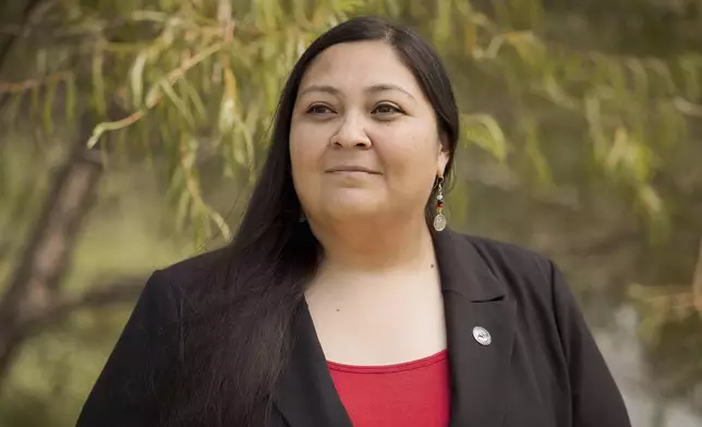 RaeLynn Butler, a Muscogee Nation citizen and one of its tribal historic preservation officers, poses for a photo, Aug. 21, 2024, in Okmulgee, Okla. (AP Photo/Brittany Bendabout)