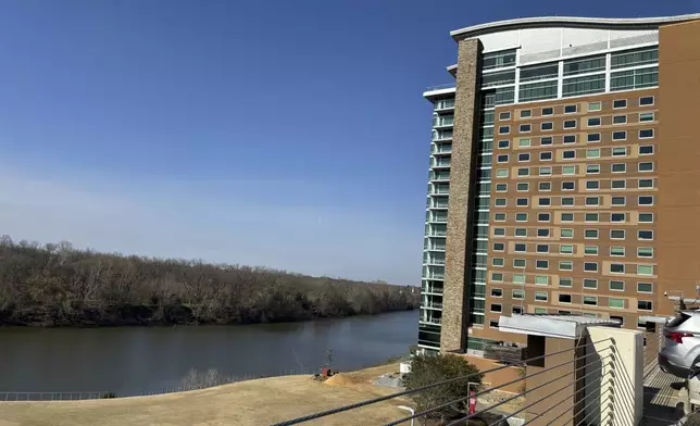 The Wind Creek Casino and Hotel overlooking the Coosa River is seen on Feb. 25, 2024, in Wetumpka, Ala., where the Oklahoma-based Muscogee (Creek) Nation contends Alabama's Poarch Band of Creek Indians broke their legal promise to preserve a historic Muscogee site when they acquired it in 1980. (AP Photo/Kim Chandler)