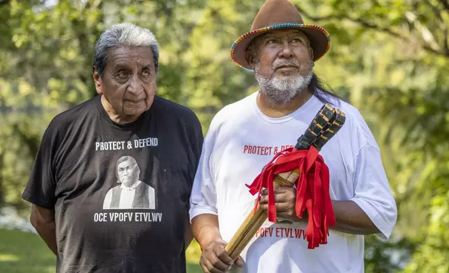 George Thompson, left, who is the Mekko, a ceremonial leader, of Hickory Ground in the Muscogee Nation, and Robyn Soweka Sr., of Hickory Ground Tribal Town, visited the Poarch Band tribe to challenge them to a game of stickball, a binding way of solving a dispute between tribes, Tuesday, Sept. 24, 2024, in Wetumoka, Ala. (AP Photo/Vasha Hunt)