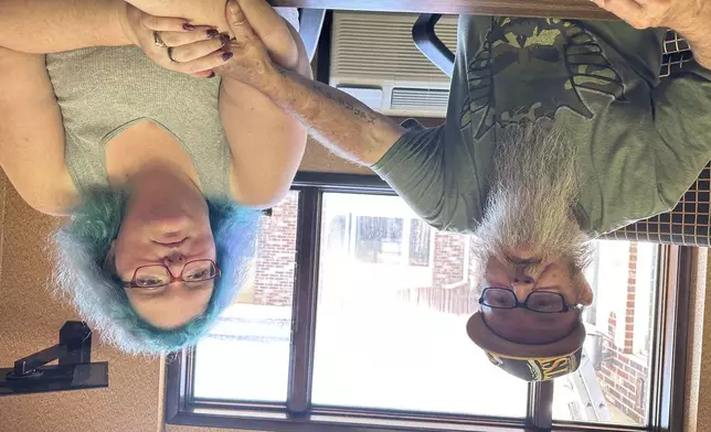 Bruce and Nova Jewett, who are experiencing homelessness, sit at the Hilltop Inn in Berlin, Vt., on Wednesday, Sept. 18, 2024, where they have been living and will have to leave by Oct. 1, 2024. (AP Photo/Lisa Rathke)