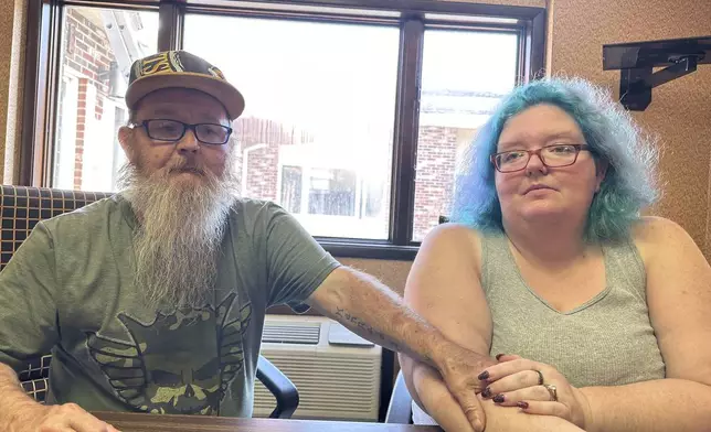 Bruce and Nova Jewett, who are experiencing homelessness, sit at the Hilltop Inn in Berlin, Vt., on Wednesday, Sept. 18, 2024, where they have been living and will have to leave by Oct. 1, 2024. (AP Photo/Lisa Rathke)