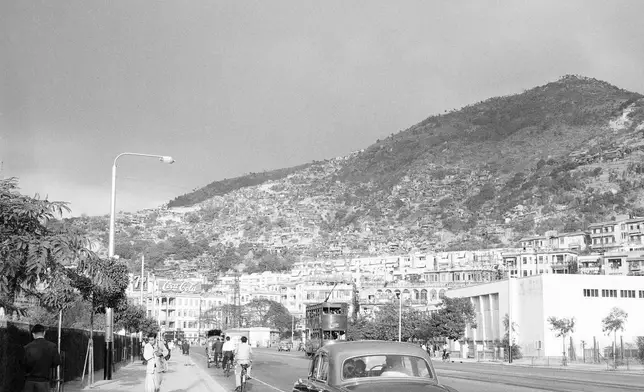 FILE- View of Hong Kong 's hillsides with "squatter" huts of refugees in this photo from 1959. (AP Photo/Fred Waters, File)