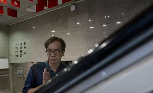 FILE - Chung Pui-kuen, the ex-chief editor of the now shuttered Stand News online outlet, outside the district court, in Hong Kong, Aug. 29, 2024. (AP Photo/Billy H.C. Kwok, File)