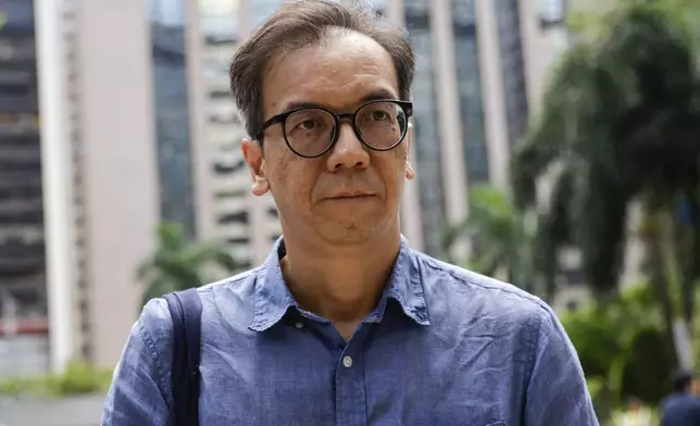 Chung Pui-kuen, the former chief editor of Hong Kong's now shuttered pro-democracy news outlet Stand News, arrives at the Wanchai District Court ahead of the final sentencing of Stand News sedition case in Wan Chai district court in Hong Kong on Thursday, Sept. 26, 2024. (AP Photo/May James)