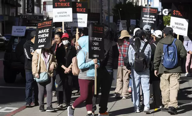 Hotel workers picket outside the Westin St. Francis hotel Monday, Sept. 2, 2024, in San Francisco. (AP Photo/Benjamin Fanjoy)