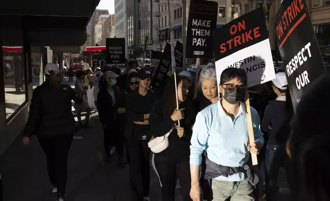 Hotel workers picket outside the Westin St. Francis Monday, Sept. 2, 2024, in San Francisco. (AP Photo/Benjamin Fanjoy)