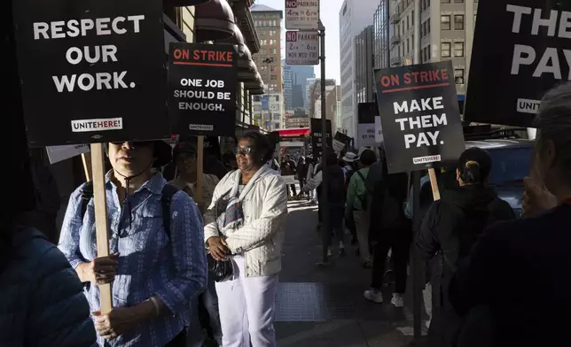 Hotel workers picket outside the Westin St. Francis Monday, Sept. 2, 2024, in San Francisco. (AP Photo/Benjamin Fanjoy)