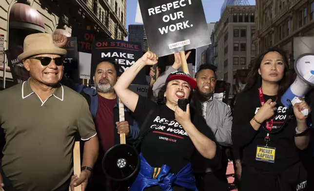 A group marches in support of hotel workers near Union Square, Monday, Sept. 2, 2024, in San Francisco. (AP Photo/Benjamin Fanjoy)