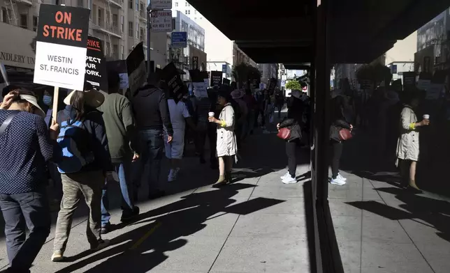 Hotel workers picket outside the Westin St. Francis Monday, Sept. 2, 2024, in San Francisco. (AP Photo/Benjamin Fanjoy)