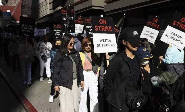 Hotel workers picket outside the Westin St. Francis Monday, Sept. 2, 2024, in San Francisco. (AP Photo/Benjamin Fanjoy)