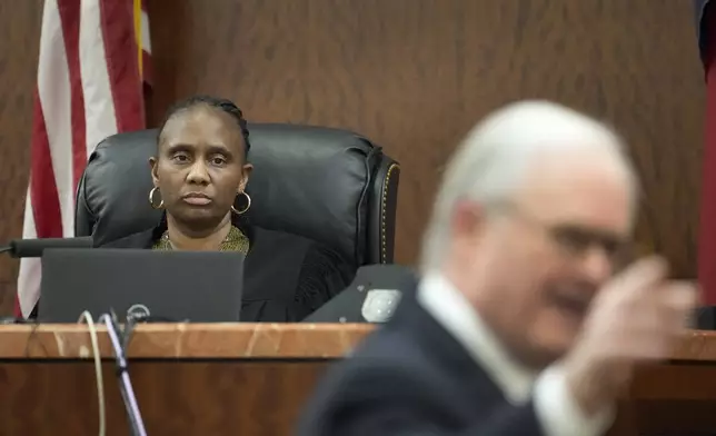 Judge Veronica M. Nelson is shown as defense attorney Mac Secrest speaks during closing arguments in the trial of former Houston police officer Gerald Goines in the 482nd District Court at the Harris County Criminal courthouse Tuesday, Sept. 24, 2024, in Houston. Goines faces two felony murder charges in the January 2019 deaths of Dennis Tuttle and Rhogena Nicholas. (Melissa Phillip/Houston Chronicle via AP)