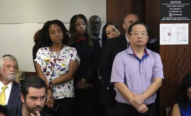 A standing room only crowd of people in the 482nd District Court at the Harris County Criminal courthouse watch the closing arguments in the case of former Houston police officer Gerald Goines Tuesday, Sept. 24, 2024, in Houston. Goines faces two felony murder charges in the January 2019 deaths of Dennis Tuttle and Rhogena Nicholas. (Melissa Phillip/Houston Chronicle via AP)