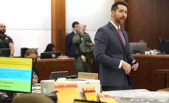 Prosecutor Keaton Forcht speaks during closing arguments in the trial of former Houston police officer Gerald Goines in the 482nd District Court at the Harris County Criminal courthouse Tuesday, Sept. 24, 2024, in Houston. Goines faces two felony murder charges in the January 2019 deaths of Dennis Tuttle and Rhogena Nicholas. (Melissa Phillip/Houston Chronicle via AP)