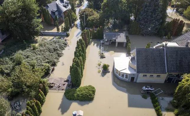 An aerial view of a flooded neighbourhood in Szentendre, Hungary, Thursday, Sept. 19, 2024. (AP Photo/Darko Bandic)