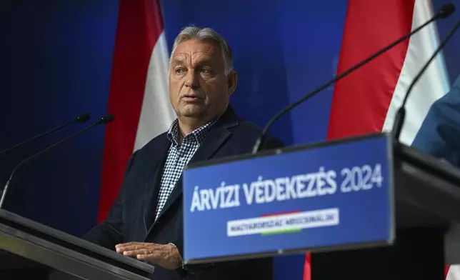 Hungarian Prime Minister Viktor Orban holds a news briefing on flood protection developments in the press room of the Prime Minister's Cabinet Office in Budapest, Hungary, Thursday, Sept. 19, 2024. (Szilard Koszticsak/MTI via AP)