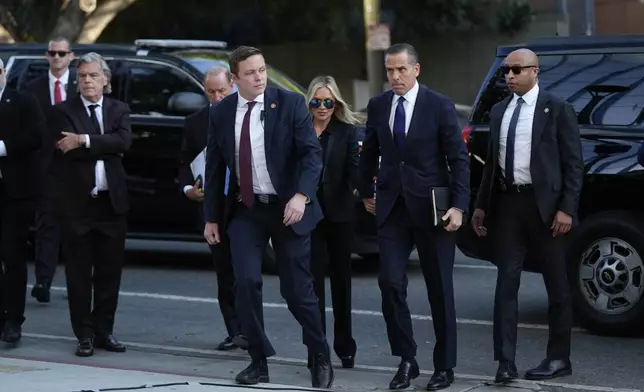 Hunter Biden and his wife Melissa Cohen Biden arrive in federal court for jury selection for his trial on felony tax charges Thursday, Sept. 5, 2024, in Los Angeles. (AP Photo/Jae C. Hong)