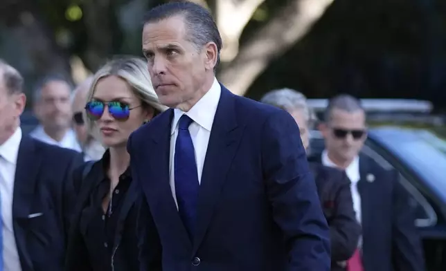 Hunter Biden, right, and his wife Melissa Cohen Biden, arrive in federal court for jury selection for his trial on felony tax charges Thursday, Sept. 5, 2024, in Los Angeles. (AP Photo/Jae C. Hong)