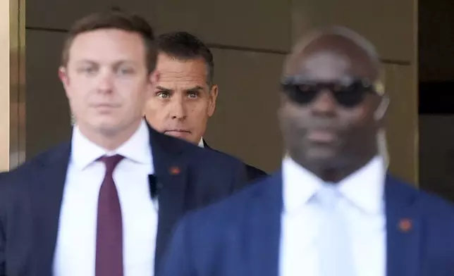 Hunter Biden, center, leaves federal court after pleading guilty in his felony federal tax case, Thursday, Sept. 5, 2024, in Los Angeles. (AP Photo/Jae C. Hong)