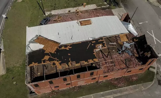 The business Chez What is seen after of Hurricane Helene moved through the area Friday, Sept. 27, 2024, in Valdosta, Ga. (AP Photo/Mike Stewart)