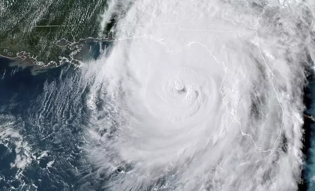 This GOES-16 GeoColor satellite image taken at 5:46 p.m. EDT and provided by National Oceanic and Atmospheric Administration (NOAA) shows Hurricane Helene in the Gulf of Mexico moving towards Florida, Thursday, Sept. 26 2024. (NOAA via AP)