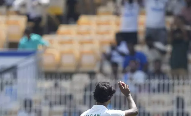 Bangladesh's Hasan Mahmud salutes the crowd with the ball after he took five wicket on the second day of the first cricket test match between India and Bangladesh, in Chennai, India, Friday, Sept.20, 2024. (AP Photo/Mahesh Kumar A.)