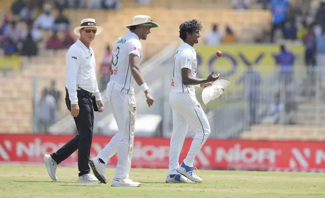 Bangladesh's Hasan Mahmud, right, celebrates his 5-wicket on the second day of the first cricket test match between India and Bangladesh, in Chennai, India, Friday, Sept.20, 2024. (AP Photo/Mahesh Kumar A.)