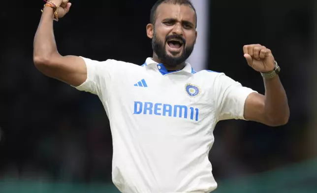 India's Akash Deep celebrates the wicket of Bangladesh's Zakir Hasan on the first day of the second cricket test match between Bangladesh and India in Kanpur, India, Friday, Sept. 27, 2024. (AP Photo/Ajit Solanki)