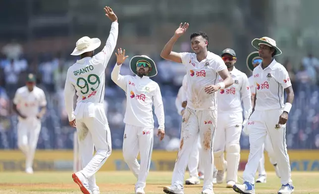 Bangladesh's Taskin Ahmed, centre, celebrates the wicket of India's Ravichandran Ashwin, with teammates on the second day of the first cricket test match between India and Bangladesh, in Chennai, India, Friday, Sept.20, 2024. (AP Photo/Mahesh Kumar A.)