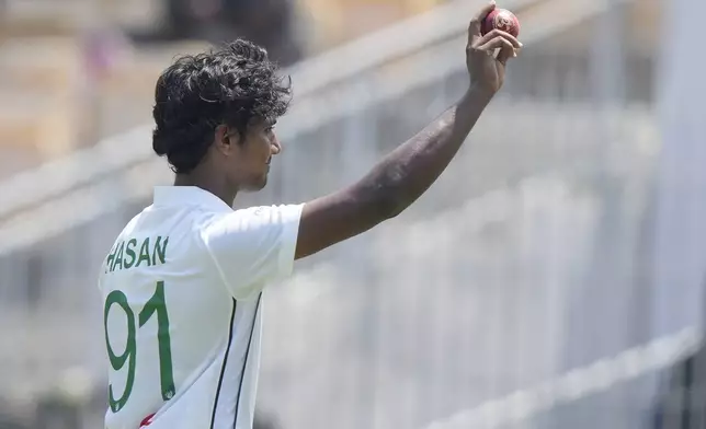 Bangladesh's Hasan Mahmud shows the ball in his hand as he celebrates his 5-wicket haul on the second day of the first cricket test match between India and Bangladesh, in Chennai, India, Friday, Sept.20, 2024. (AP Photo/Mahesh Kumar A.)