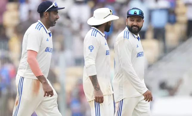 India's Ravichandran Ashwin, left, Ravindra Jadeja, centre, and captain Rohit Sharma walks after India won the first test match against Bangladesh in Chennai, India, Sunday, Sept. 22, 2024. (AP Photo/Mahesh Kumar A.)