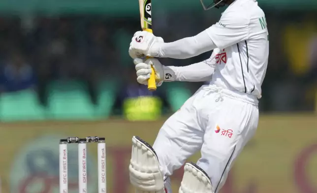 Bangladesh's Mominul Haque plays a shot on the fourth day of the second cricket test match between Bangladesh and India in Kanpur, India, Monday, Sept. 30, 2024. (AP Photo/Ajit Solanki)