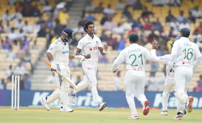 Bangladesh's Hasan Mahmud celebrates the wicket of India's Rishabh Pant, left, on the first day of the first cricket test match between India and Bangladesh, in Chennai, India, Thursday, Sept.19, 2024. (AP Photo/Mahesh Kumar A.)