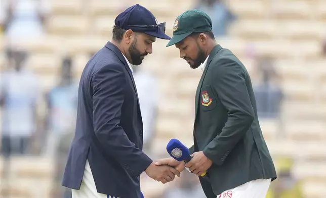 India's captain Rohit Sharma, left, and Bangladesh's captain Najmul Hossain Shanto greet each other before the start of the first cricket test match between India and Bangladesh, in Chennai, India, Thursday, Sept.19, 2024. (AP Photo/Mahesh Kumar A.)