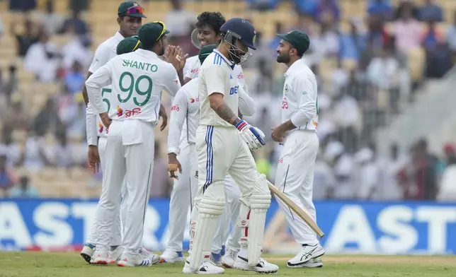 India's Virat Kohli walks to the pavilion after losing his wicket to Bangladesh's Hasan Mahmud on the first day of the first cricket test match between India and Bangladesh, in Chennai, India, Thursday, Sept.19, 2024. (AP Photo/Mahesh Kumar A.)