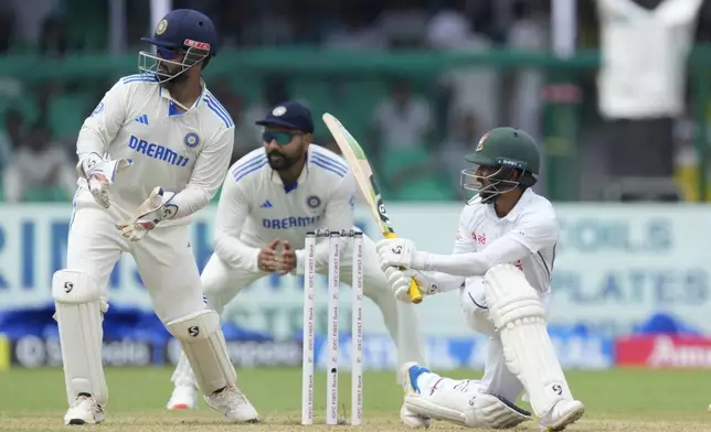 Bangladesh's Mominul Haque plays a shot on the first day of the second cricket test match between Bangladesh and India in Kanpur, India, Friday, Sept. 27, 2024. (AP Photo/Ajit Solanki)