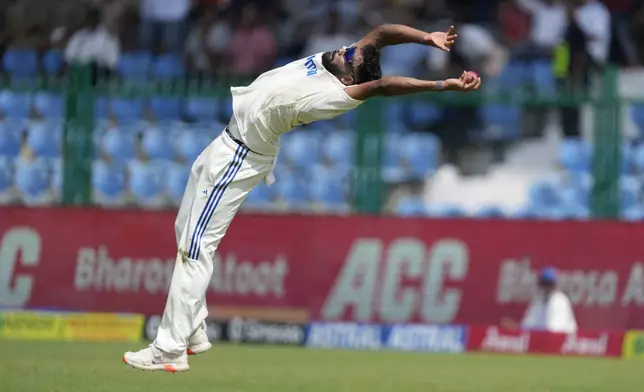 India's Mohammed Siraj takes the catch to get the wicket of Bangladesh's Shakib Al Hasan on the fourth day of the second cricket test match between Bangladesh and India in Kanpur, India, Monday, Sept. 30, 2024. (AP Photo/Ajit Solanki)