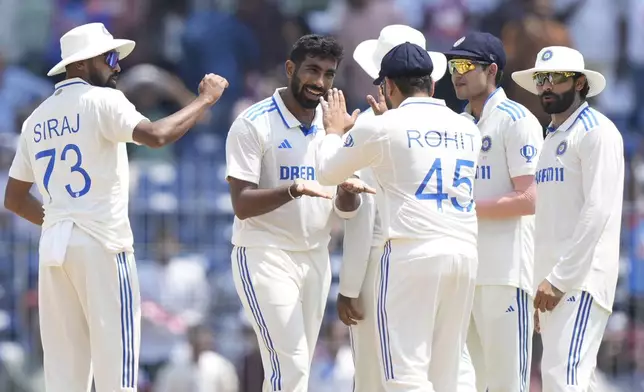 India's Jasprit Bumrah, centre, celebrates with teammates the wicket of Bangladesh's Shadman Islam on the second day of the first cricket test match between India and Bangladesh, in Chennai, India, Friday, Sept.20, 2024. (AP Photo/Mahesh Kumar A.)