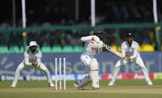 Bangladesh's Mominul Haque plays a shot on the fourth day of the second cricket test match between Bangladesh and India in Kanpur, India, Monday, Sept. 30, 2024. (AP Photo/Ajit Solanki)