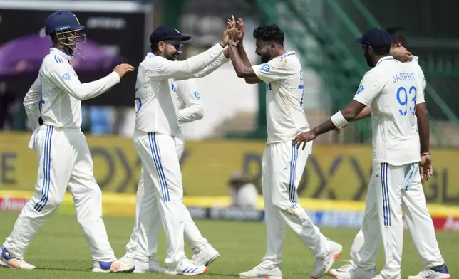 Indian players celebrates the wicket of Bangladesh's Shakib Al Hasan on the fourth day of the second cricket test match between Bangladesh and India in Kanpur, India, Monday, Sept. 30, 2024. (AP Photo/Ajit Solanki)