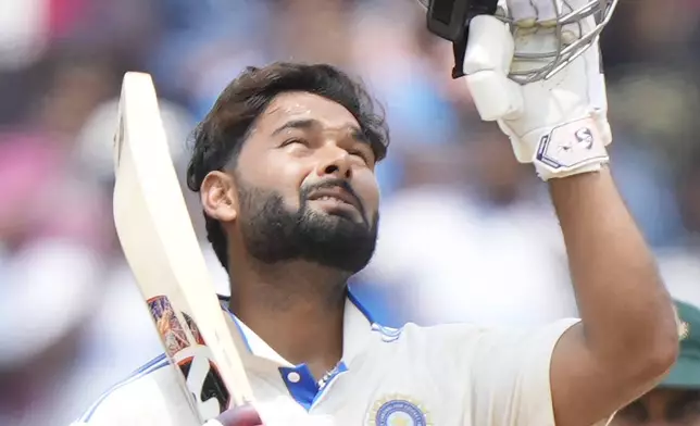 India's Rishabh Pant celebrates scoring a century on the third day of the first cricket test match between India and Bangladesh, in Chennai, India, Saturday, Sept. 21, 2024. (AP Photo/Mahesh Kumar A.)