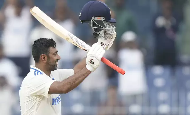 India's Ravichandran Ashwin celebrates scoring a century on the first day of the first cricket test match between India and Bangladesh, in Chennai, India, Thursday, Sept.19, 2024. (AP Photo/Mahesh Kumar A.)