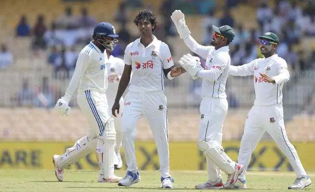 Bangladesh's Hasan Mahmud celebrates with his teammates after taking wicket of India's Jasprit Burmah on the second day of the first cricket test match between India and Bangladesh, in Chennai, India, Friday, Sept.20, 2024. (AP Photo/Mahesh Kumar A.)